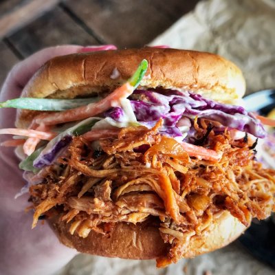 crockpot bbq pulled chicken on sandwich with coleslaw