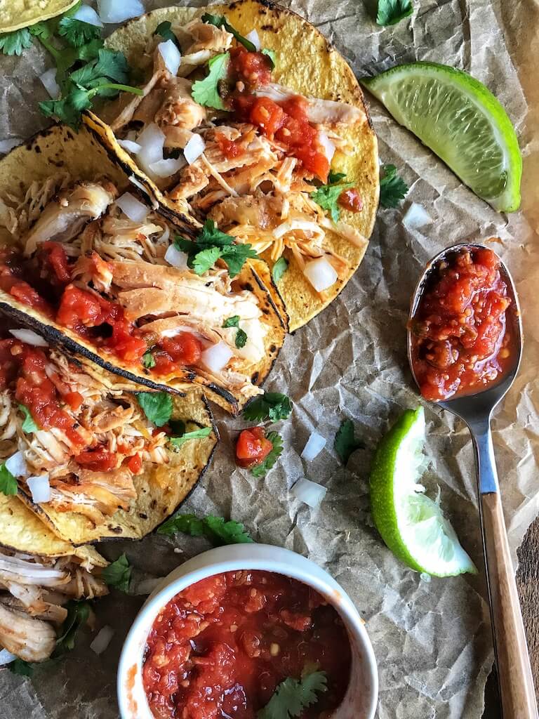 Slow Cooker Chicken Carnitas with salsa, lime, cilantro, and onion