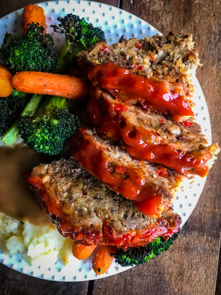 The Best Meatloaf on plate with vegetables
