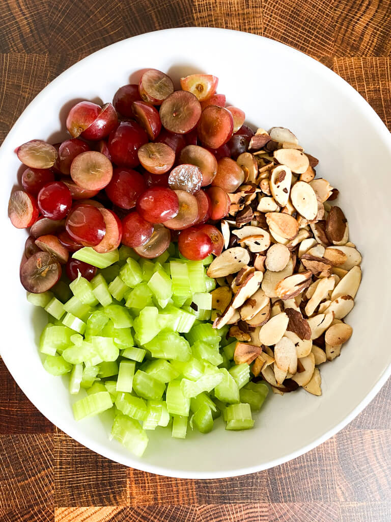 bowl of sliced grapes, toasted almonds, and diced celery
