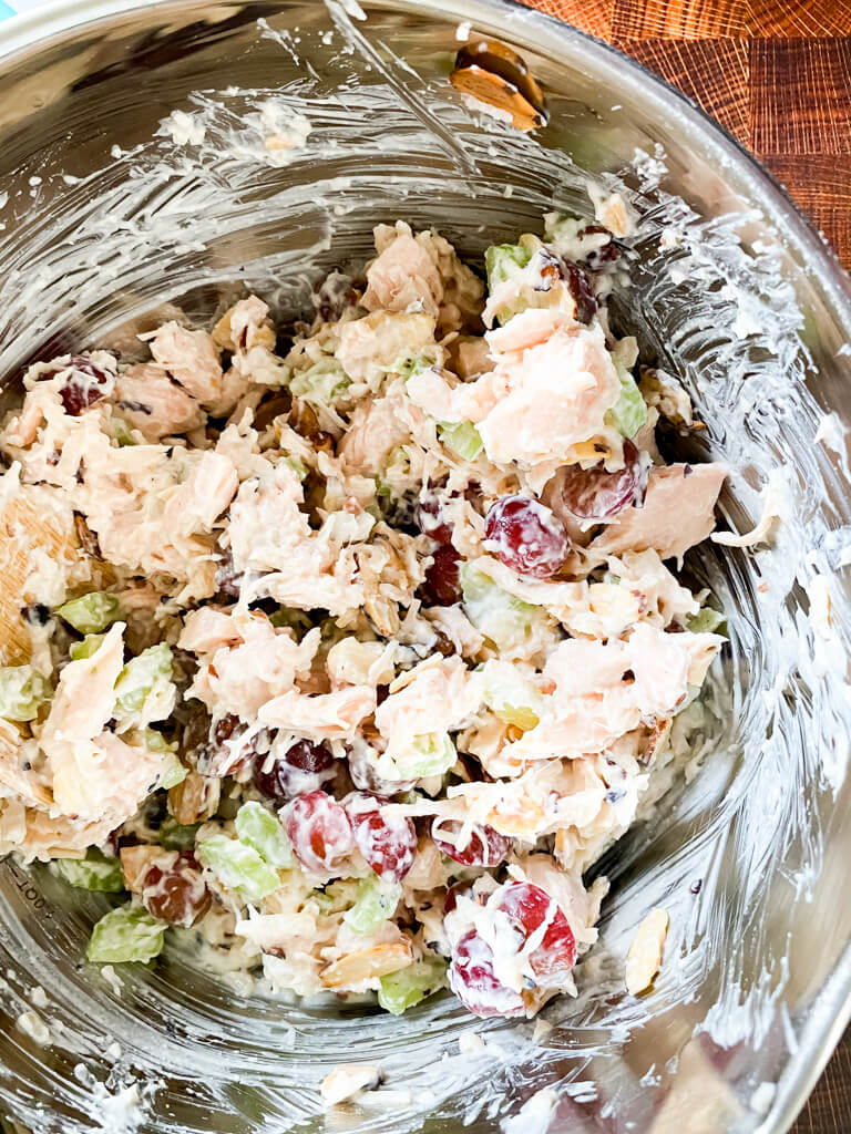 Chicken Salad with Grapes being all mixed together