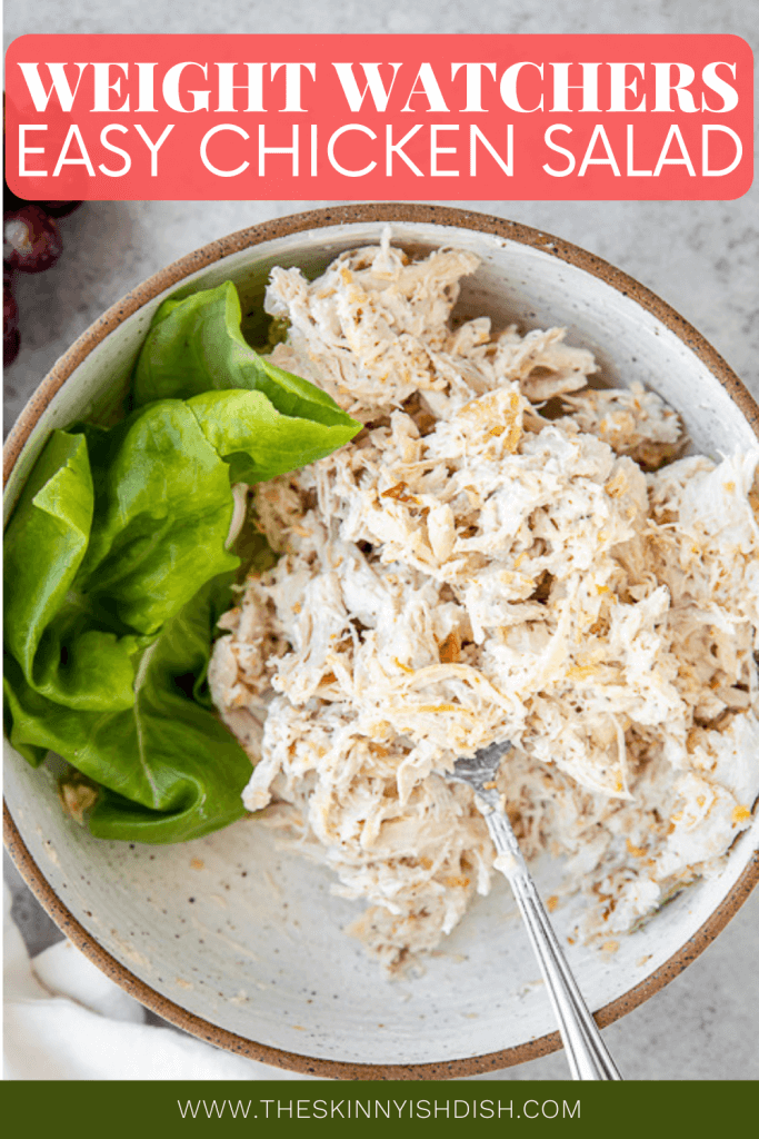 chicken salad in a bowl with lettuce on the side
