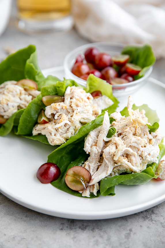 chicken salad with lettuce wraps topped with grapes