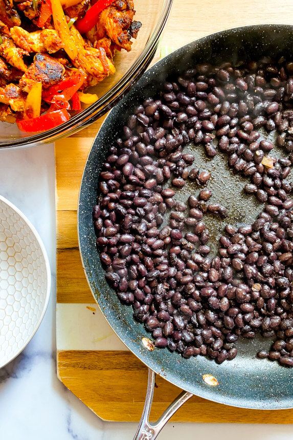 black beans warmed up in the pan