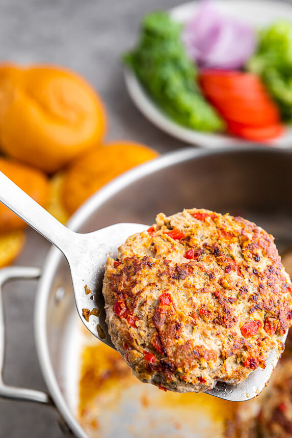 Greek Turkey burger in pan on a spatula
