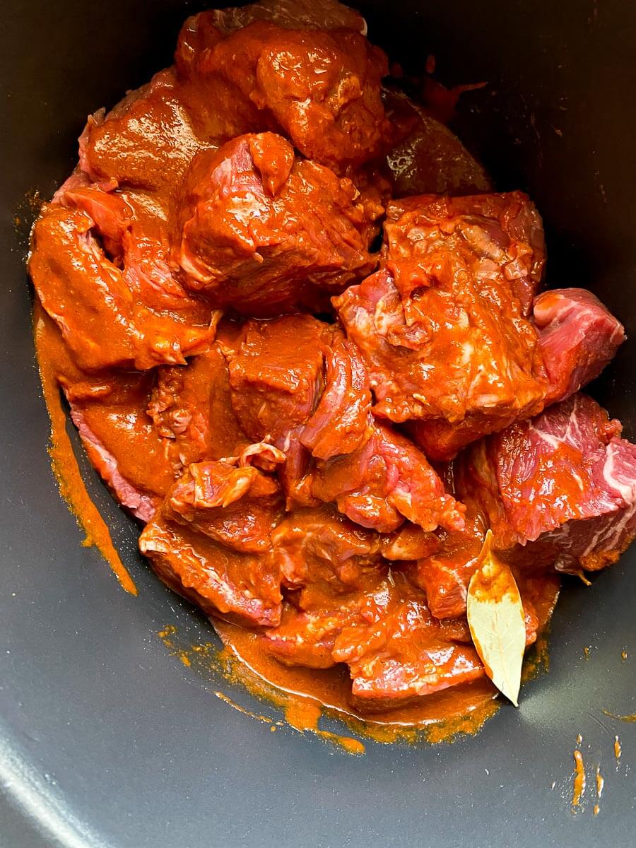 beef chunks covered in orange marinade 
