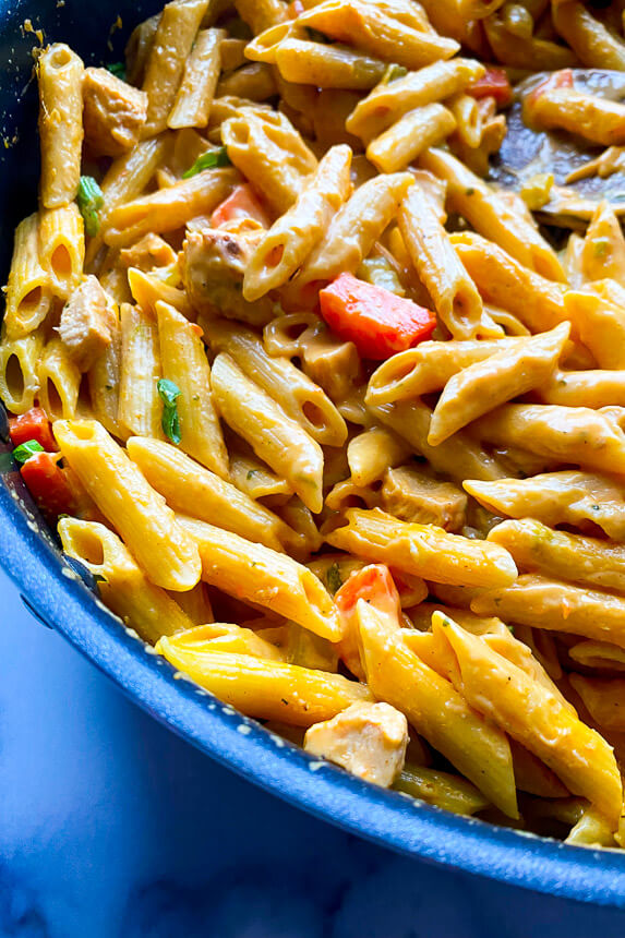 large skillet with pasta in it 