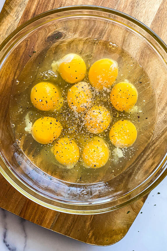 eggs in a bowl with salt and pepper