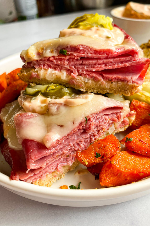 corned beef sandwich with carrots on the plate 