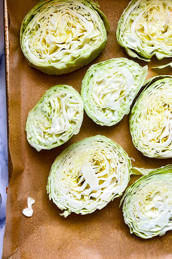 slices of cabbage on sheet pan