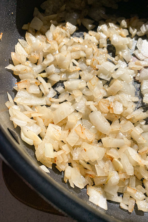 onions cooking in a skillet