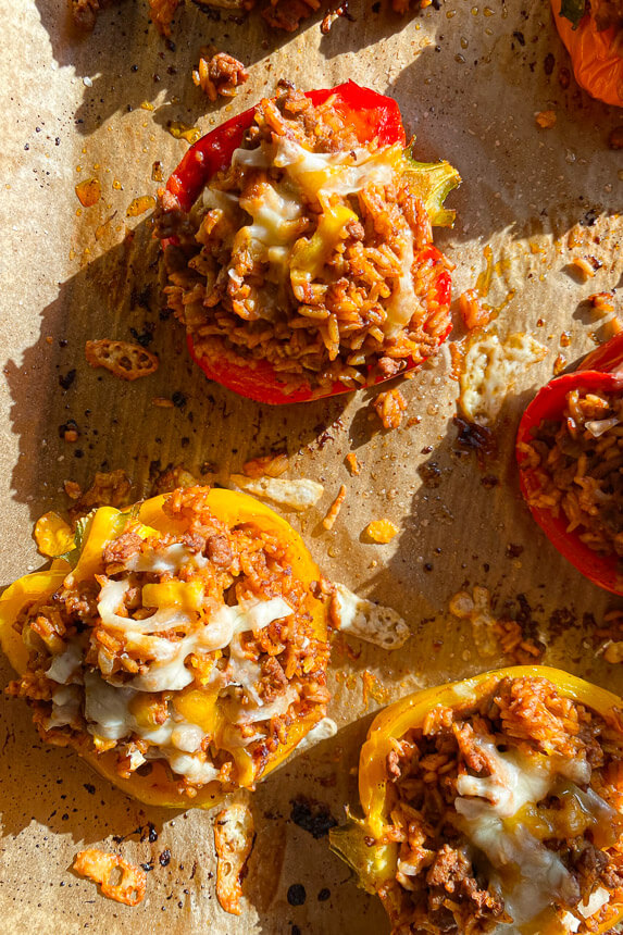 taco stuffed peppers with melted cheese on top
