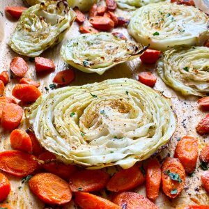 roasted cabbage and carrots on a sheet pan