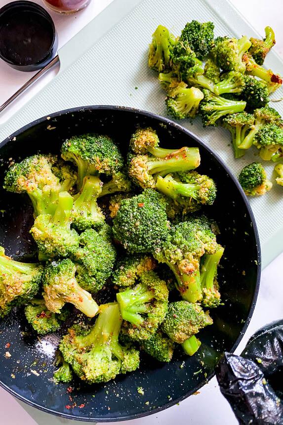 bowl of frozen broccoli with seasonings