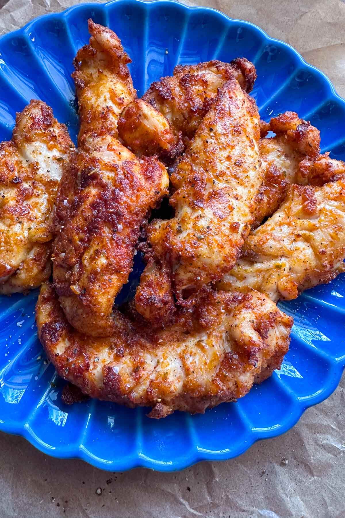 air fryer chicken tenders on a blue plate 