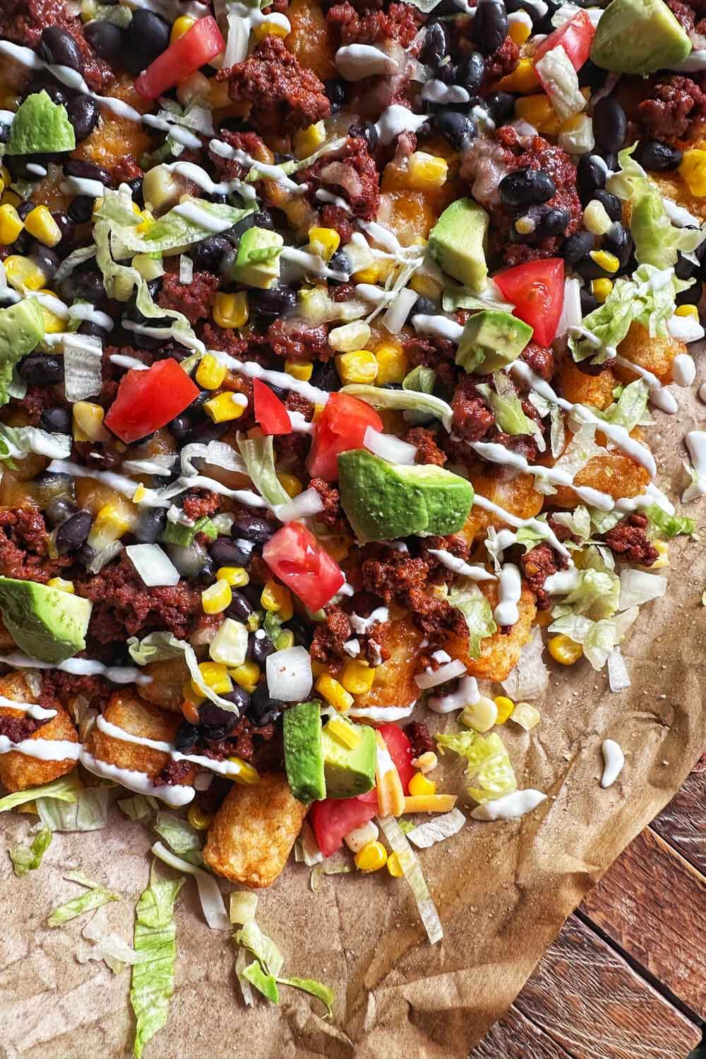 sheet pan with tater tot nachos on top