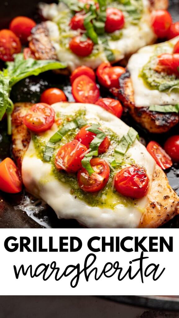 Easy grilled chicken margherita recipe with melted mozzarella basil pesto and roasted cherry tomatoes in a skillet