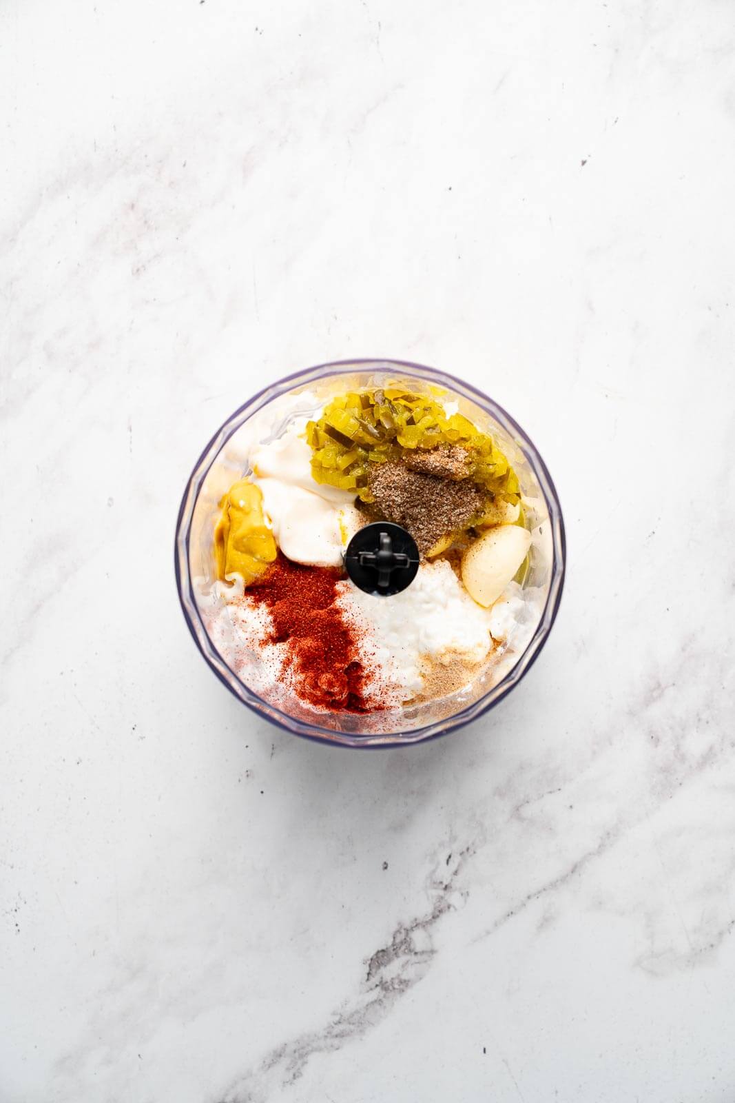 egg yolks, cottage cheese, dill relish, and smoked paprika in a bowl