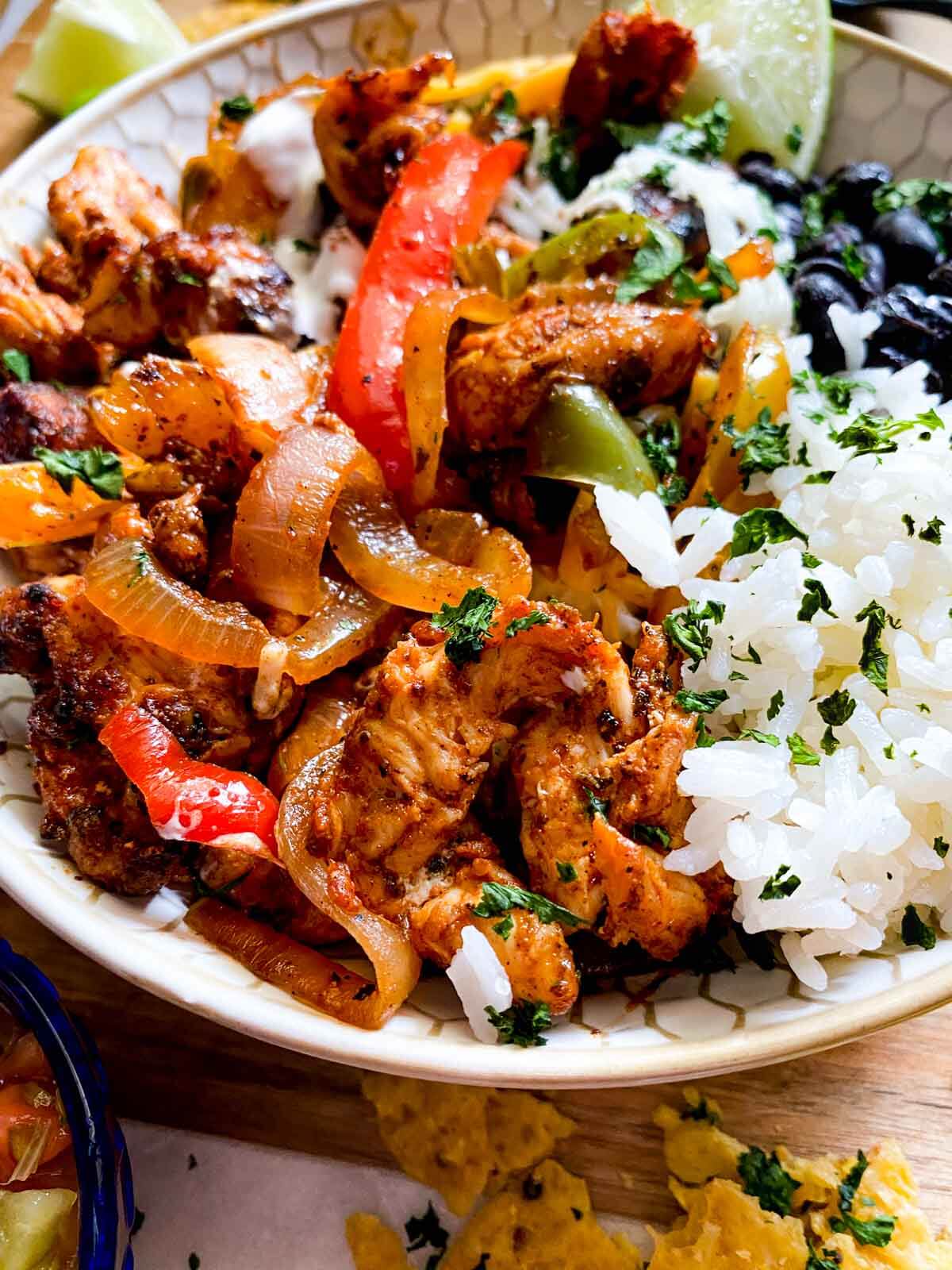 chicken fajita bowl with rice and black beans.