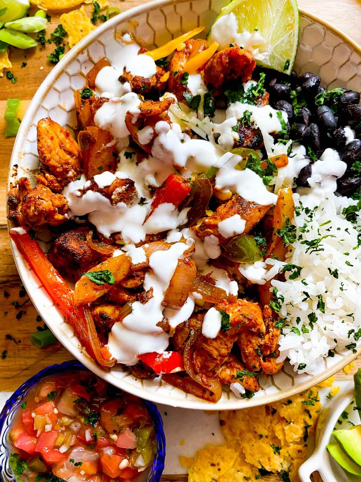 fajita bowl with a big drizzle of lime crema.