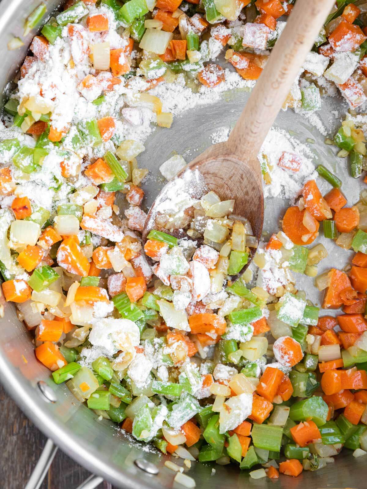 Flour sprinkled over sautéed vegetables to thicken the soup.