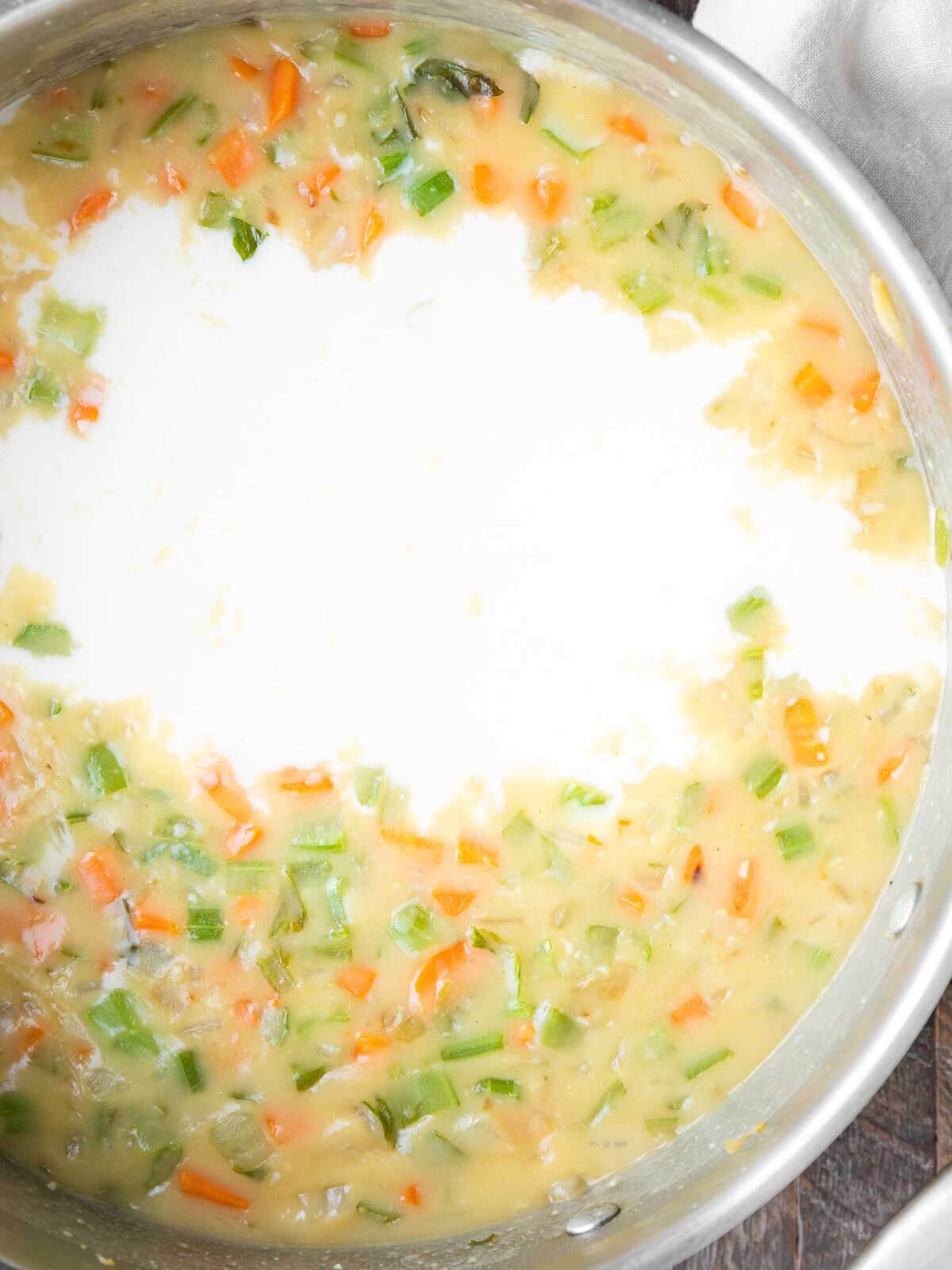 Milk and chicken broth added into the chicken pot pie soup base.