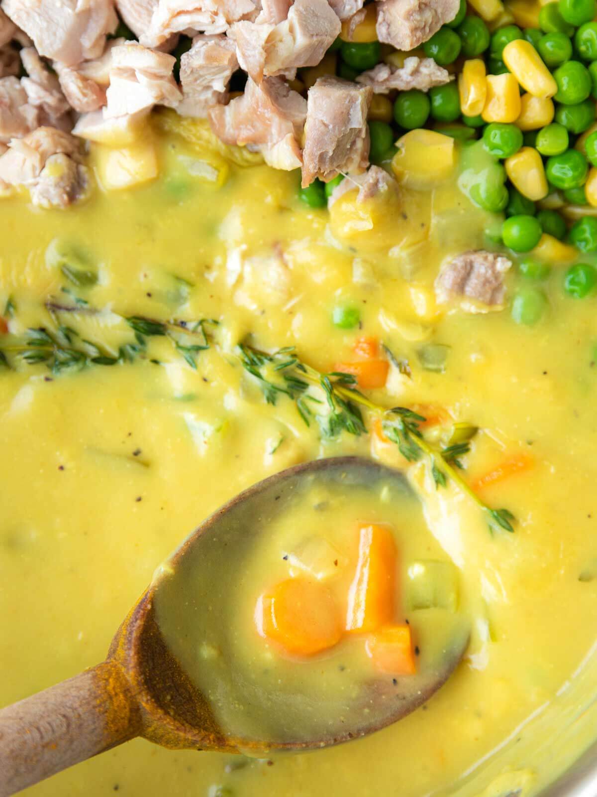 Cooked chicken, frozen peas, and corn added to chicken pot pie soup.