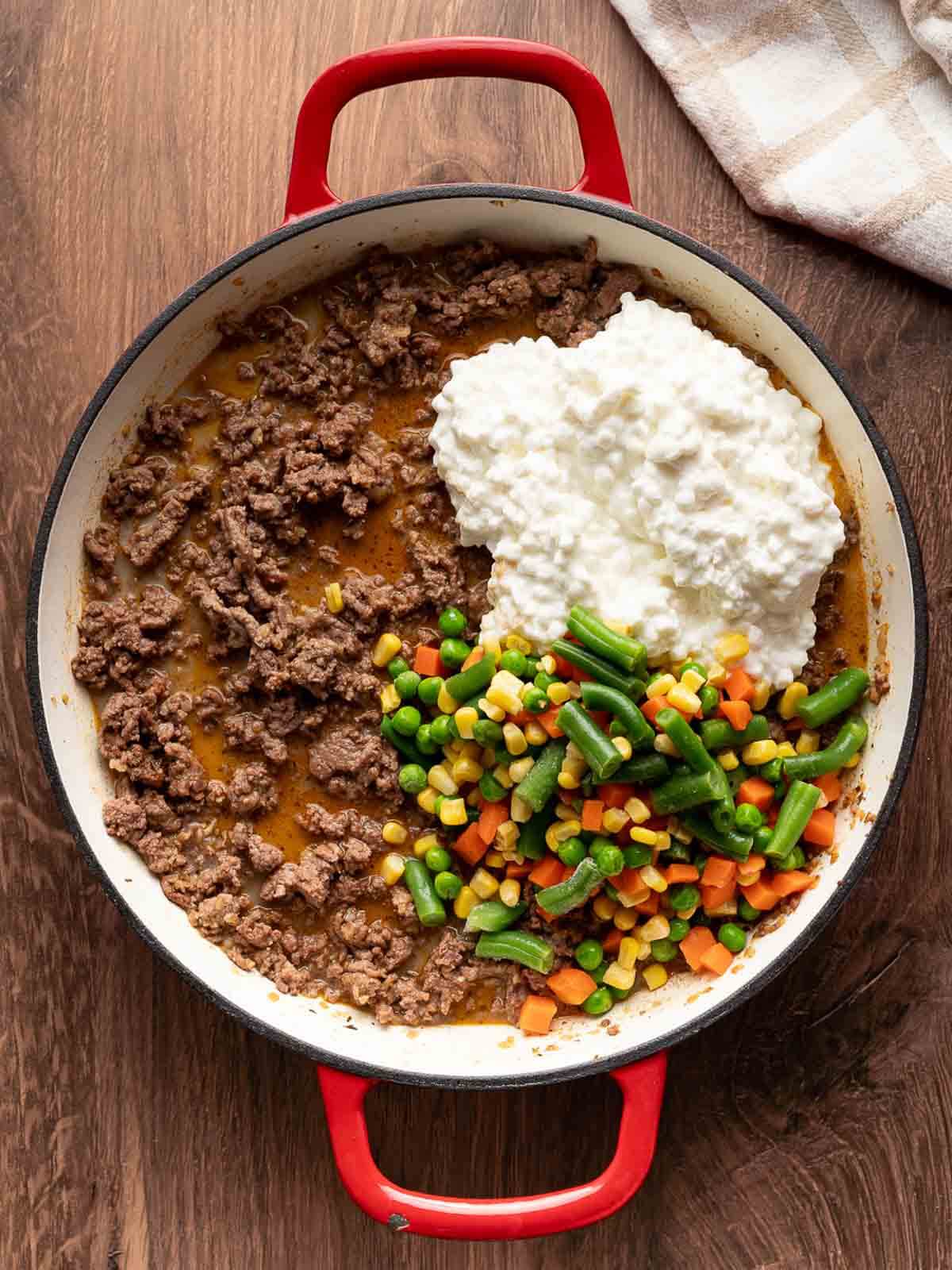 ground beef mixture with the mixed vegetables and cottage cheese being added.